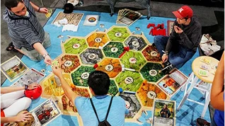 Team of players collaborating in a board game